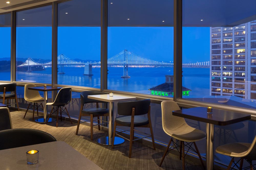 Photo of rooftop Regency Lounge at Hyatt San Francisco, in evening.