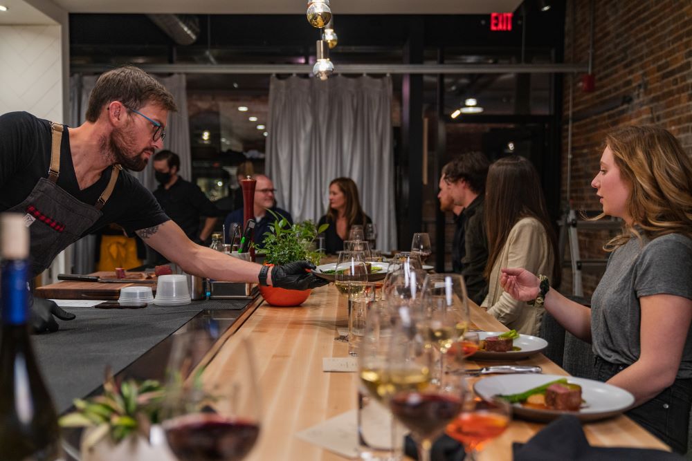 Kevin Scharpf serving food at Braen Reserve in Brazen Open Kitchen