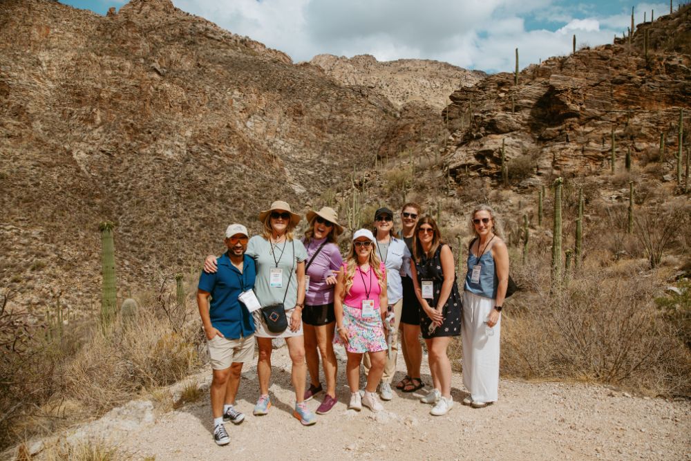 Group of attendees exploring the desert. Credit: Wandering Maverick Photo+Film