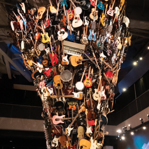 Photo of Roots and Branches sculpture with hundreds of guitars at Museum of Pop Culture.