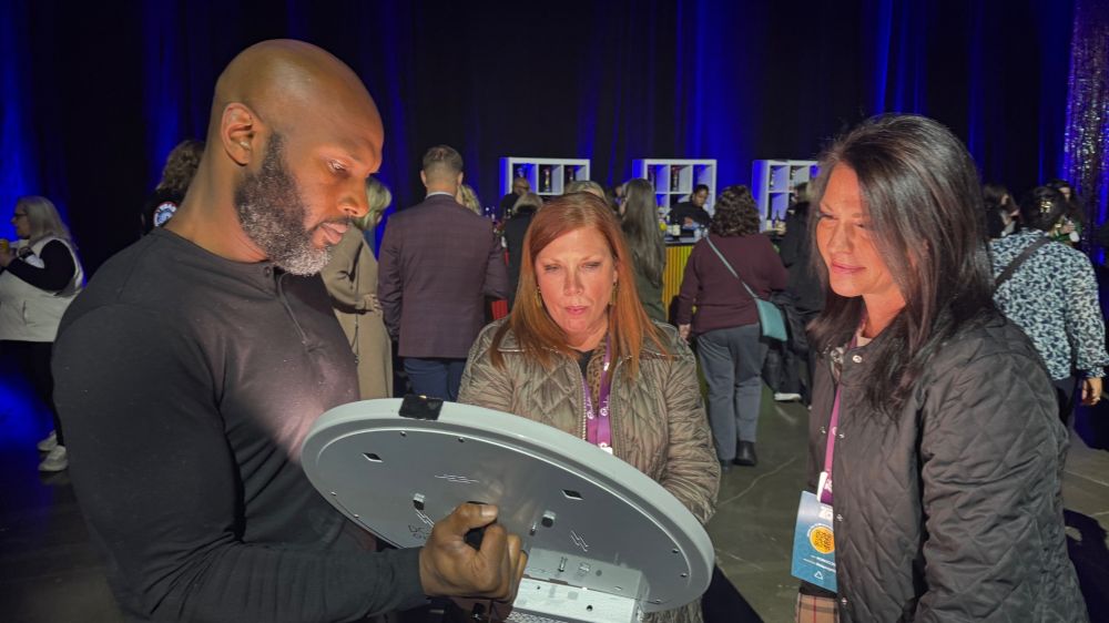 Attendees engaging in some mobile photo fun during the opening night reception at the Pennsylvania Convention Center.