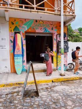 A surfboard and storefront in Sayulita