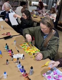 People involved in an art project at ArtPlay. 