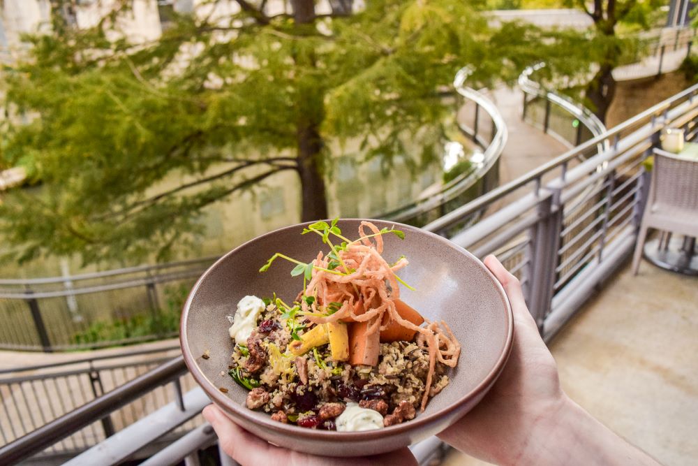 Photo of a plate of food in a hand at Biga on the Banks restaurant.