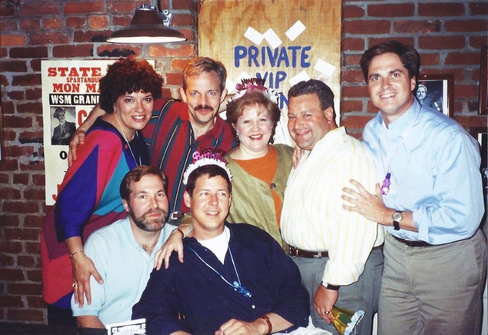 Joan Eisenstodt (center) posing with some of her Birthday Club members at an industry event.
