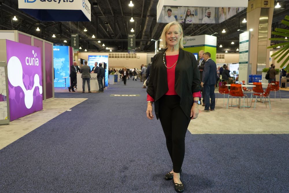 Photo of PHL Life Sciences' Bonnie Grant on convention hall floor.