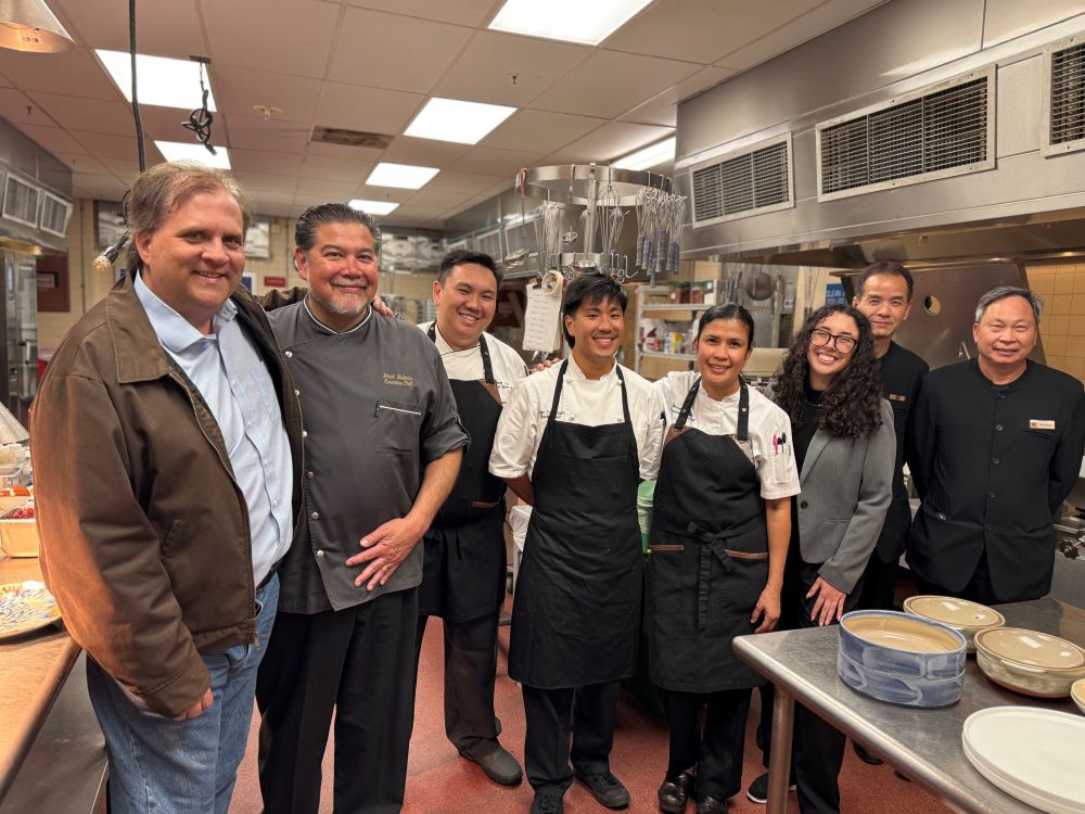 Photo of a group of people standing in the kitchen of the San Francisco Marriott Marquis.