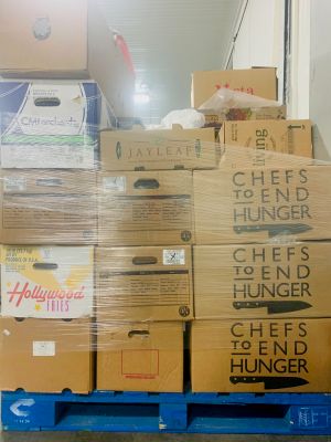 Photo of a stack of Chefs to End Hunger food donation boxes.