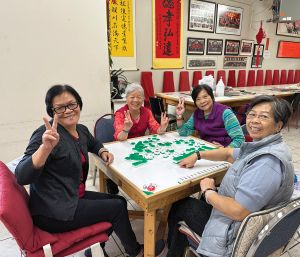 Four women sitting at a table during the Historical Chinatown tour with Judy Lam Maxwell.