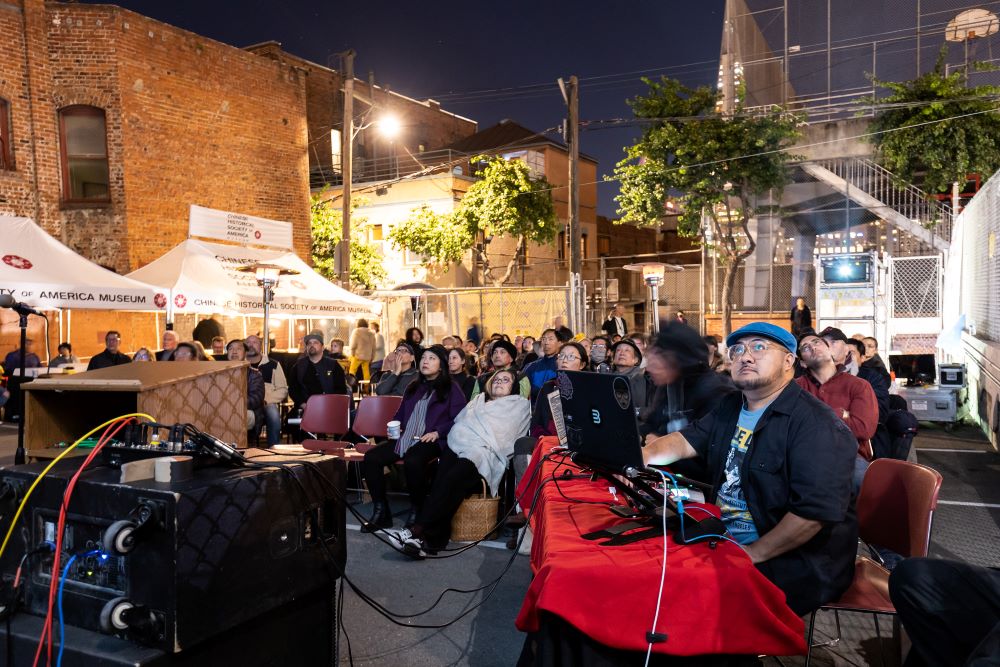 Photo of crowd enjoying a DJ at Chinese Historical Society of America.