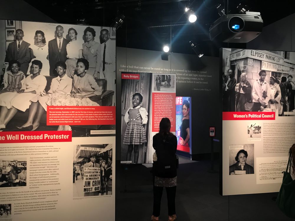 Photo of woman standing in exhibit at National Center for Civil and Human Rights.