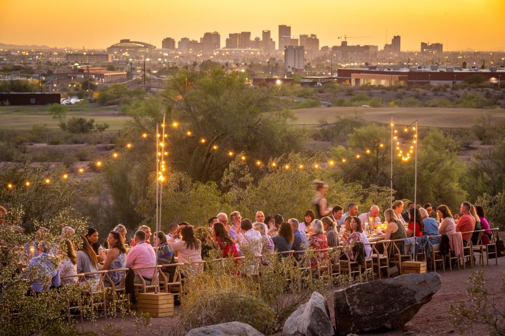 Photo of outdoor dining in Arizona desert from Cloth & Flame.