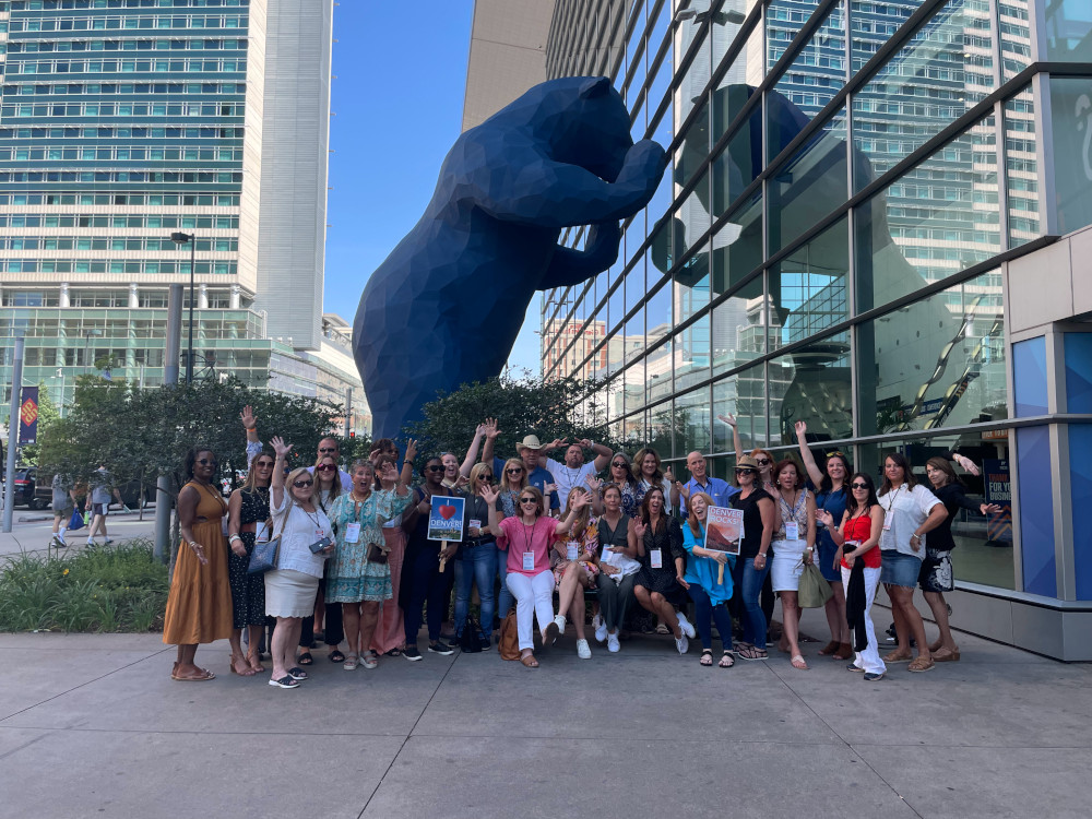 Meetings Today LIVE! attendees pose outside of Colorado Convention Center