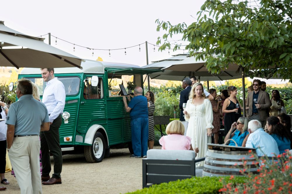 Mobile bar at Dry Creek Vineyards, with people standing around it.