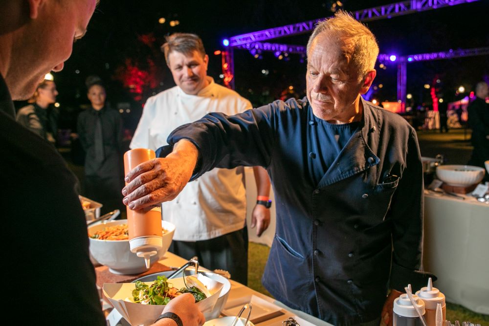 Phtoto of Wolfgang Puck with Vice President of Culinary Eric Klein at Adobe Max Bash.