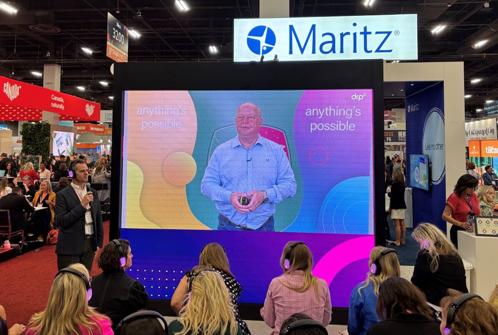 Dale Parmenter of communications firm DRPG spoke from London to planners at the Maritz exhibit stand. 