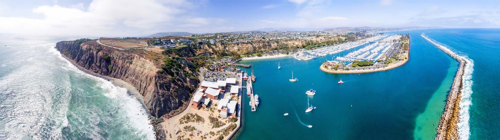 Panoramic photo of Dana Point California harbor and coastline.