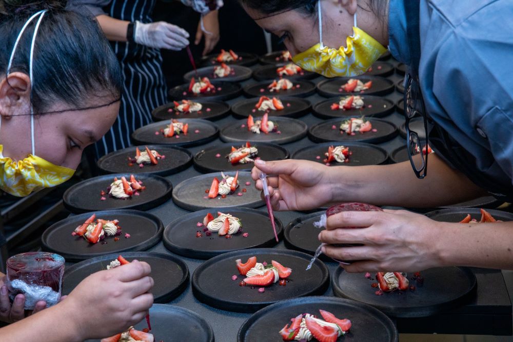 Chefs working on fresh food at Hotel Xcaret Arte