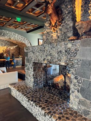 Photo of the lobby fireplace at the Grand Bohemian Lodge Greenville.