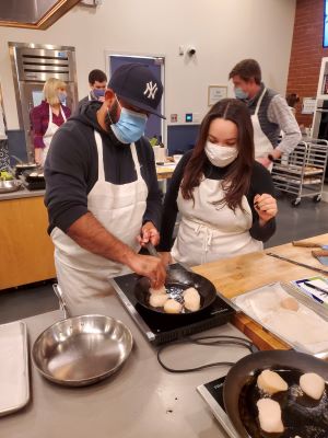 Guests participating in Chef Alyssa's Kitchen group dining class.