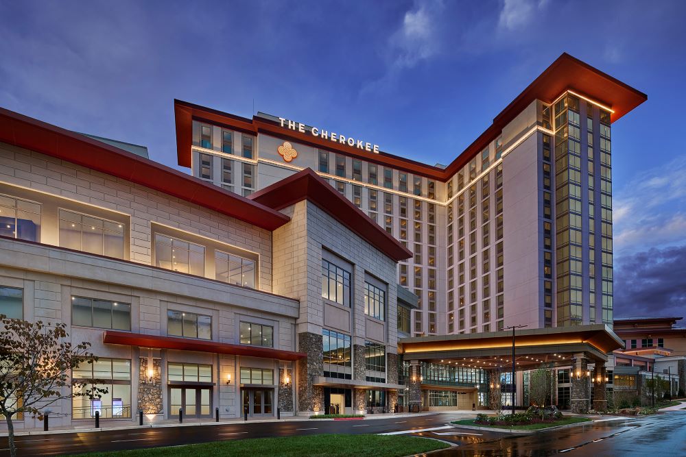 Photo of Harrah's Cherokee Resort Casino exterior at night.