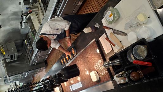 Chef working on cuisine in the kitchen of the Hilton Anaheim.