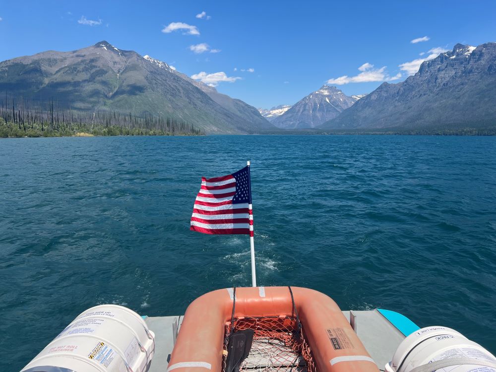 View from the top deck of Glacier Park Boat Company vessel cruising on Lake McDonald in Glacier National Park