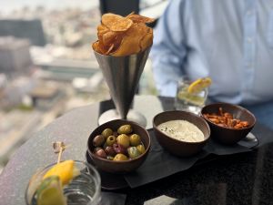 Photo of a Mediterranean dips plate and potato chips at The View Lounge.