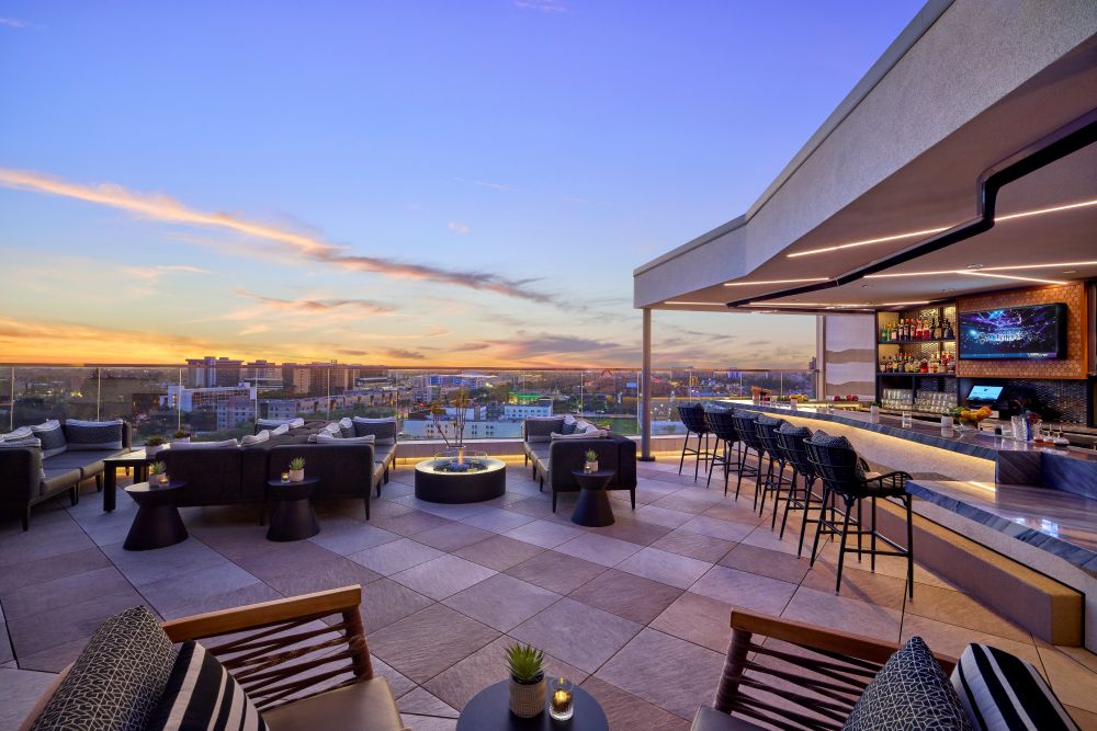 Image of Parkestry Rooftop Bar over looking the Anaheim skyline.