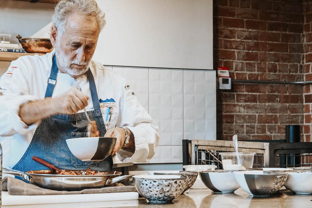 Janos Wilder cooking in the kitchen