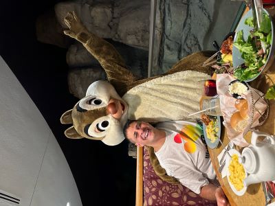 Jonathan Alder poses with Dale at a Disney Character Breakfast