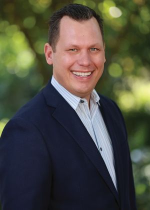 Jonny Westom in a blue blazer.