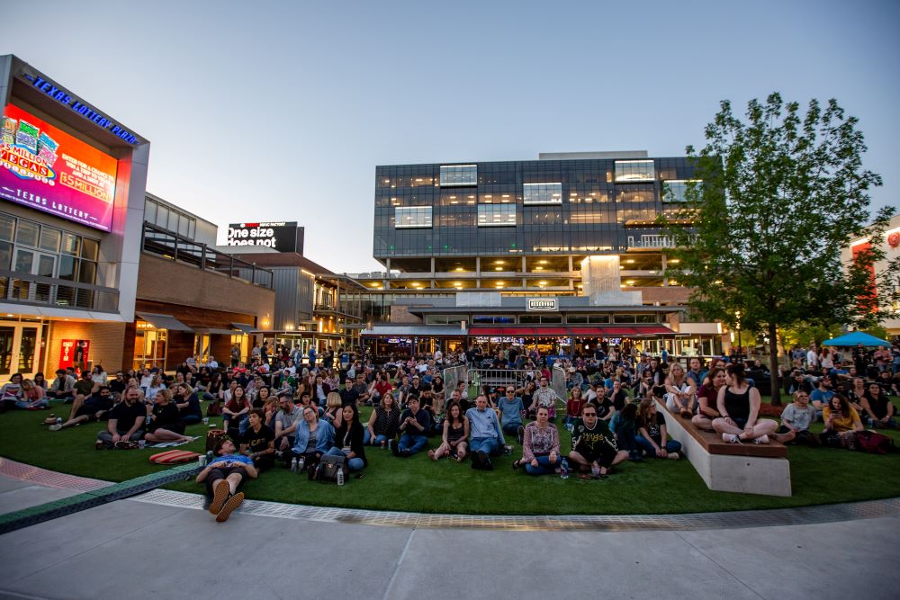 Photo of crowd on lawn at Texas Lottery Plaza.