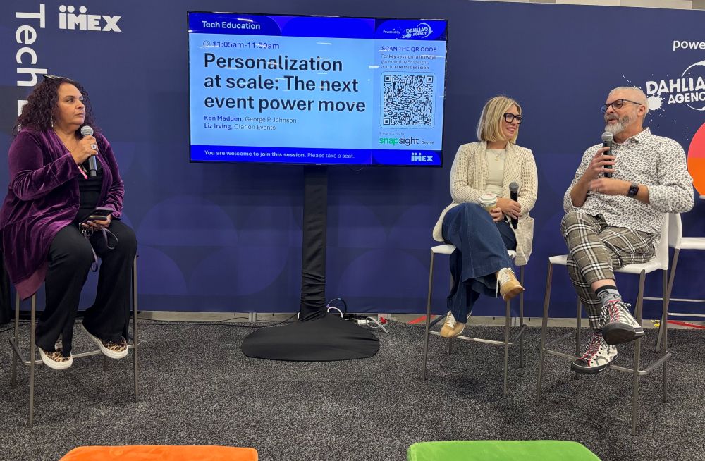 Liz Irving and Ken Madden chat with Dahlia El-Gazzar during the attendee-personalization session.