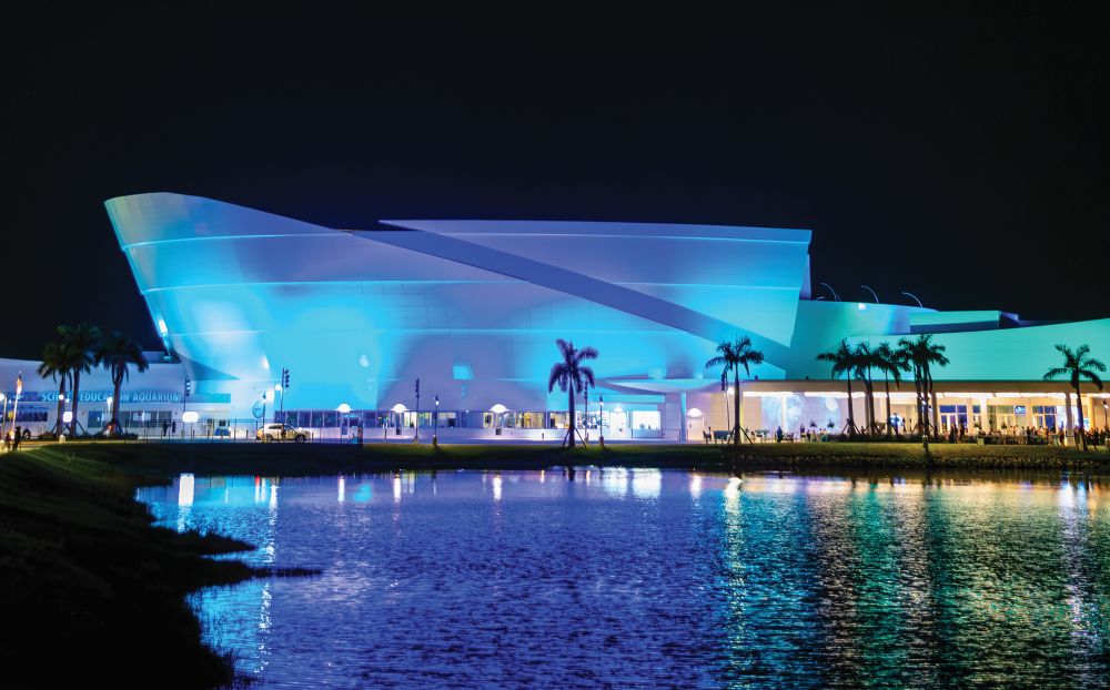 Mote Marine Laboratory and Aquarium exterior at night.