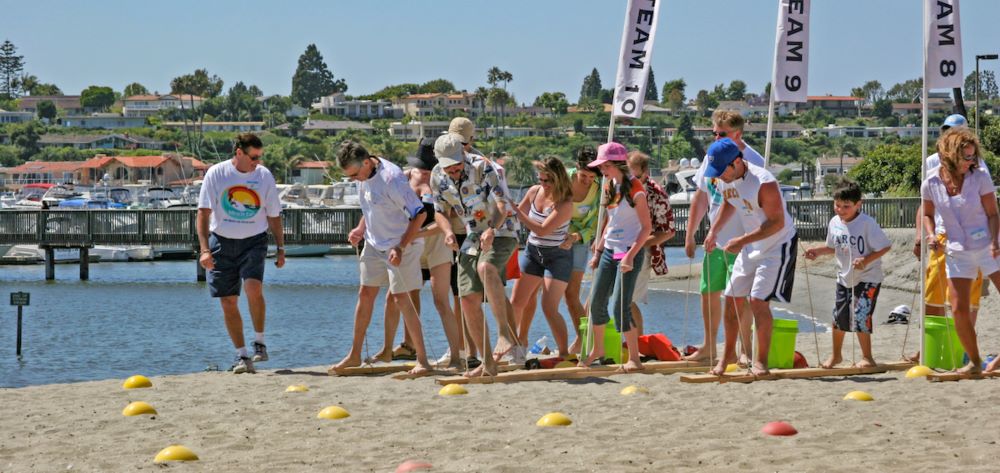 Photo of people on the beach engaging in a teambuilding program at Newport Dunes Resort and Marina.