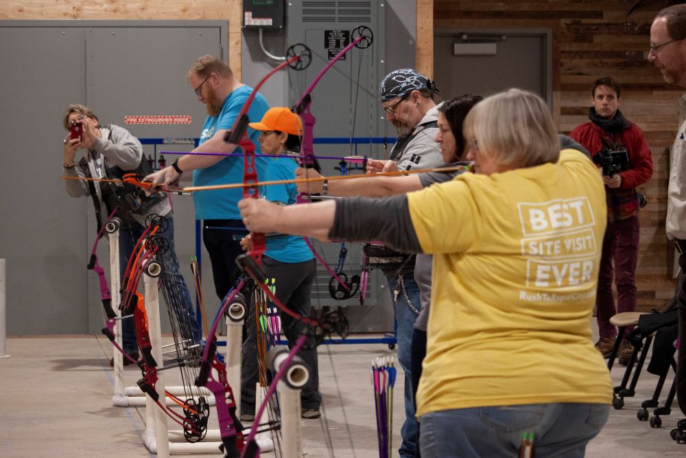 People practicing archery at Outdoor Campus West.
