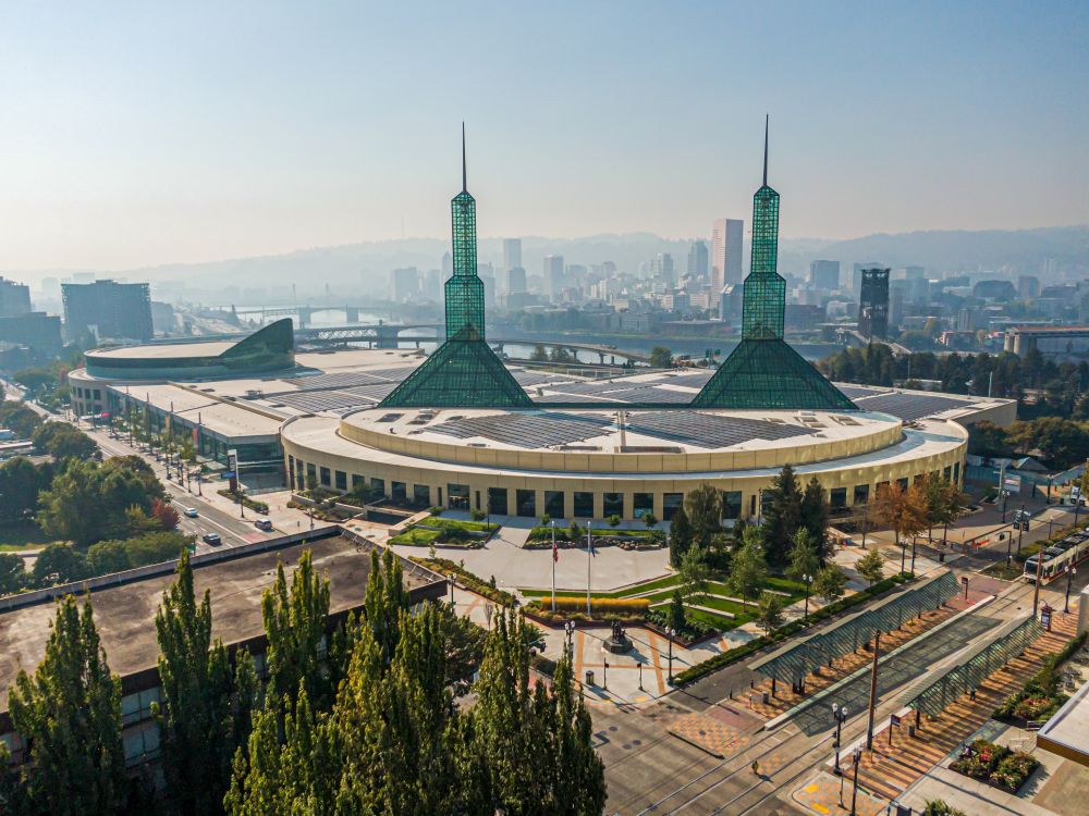 Oregon Convention Center exterior with Portland in the background.
