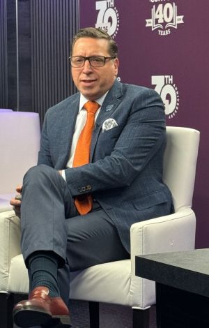 Led by Jorge L. Pérez sitting in a white chair.