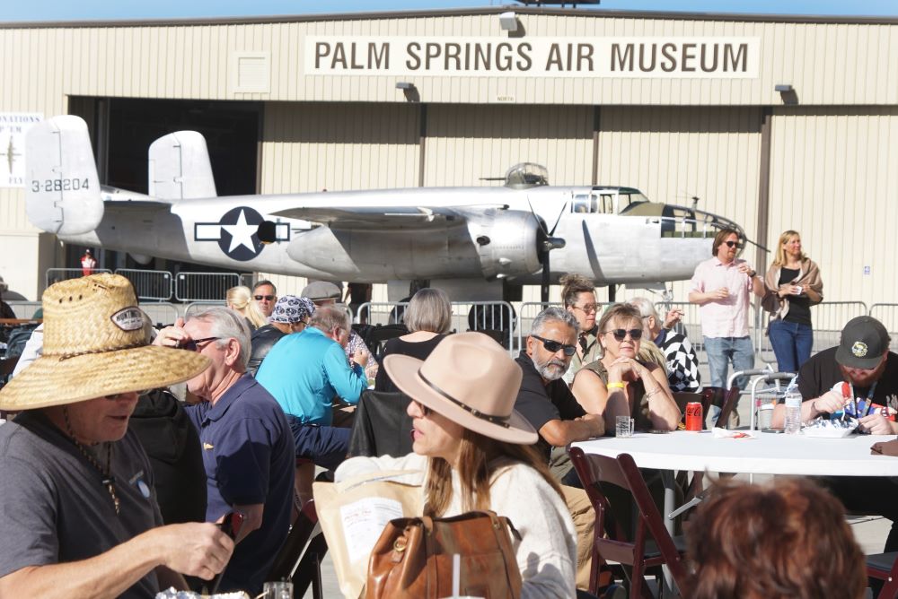 Photo of Palm Springs Air Museum event with aircraft in background..