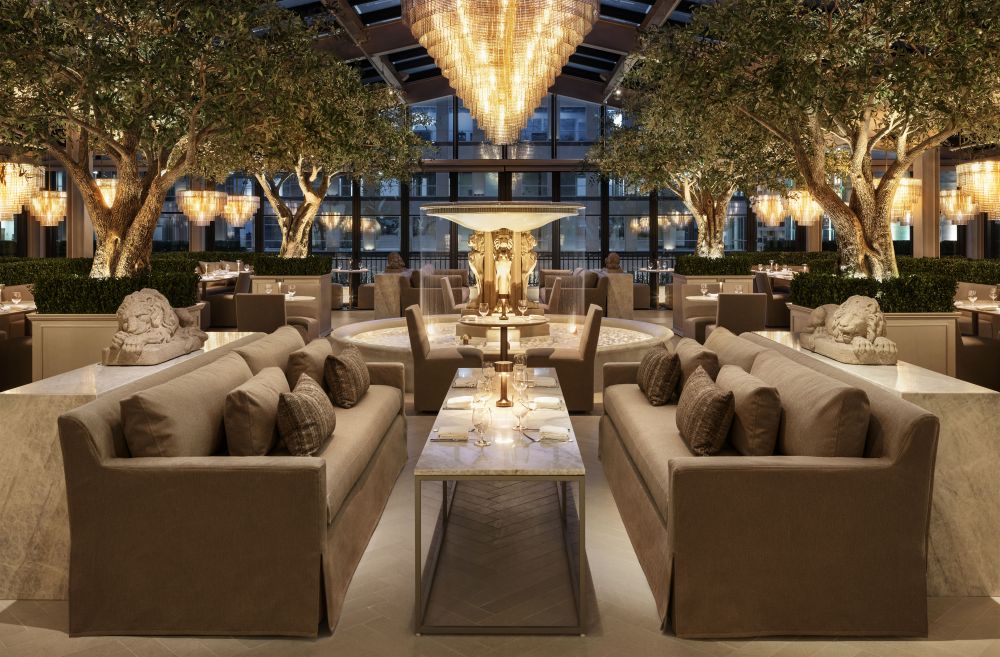 Photo of RH Rooftop Restaurant sitting area under a large chandelier.