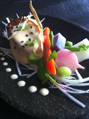 Photo of food item on a black plate.