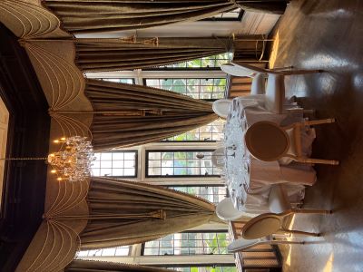 Round table setup in Casa Loma's Library room