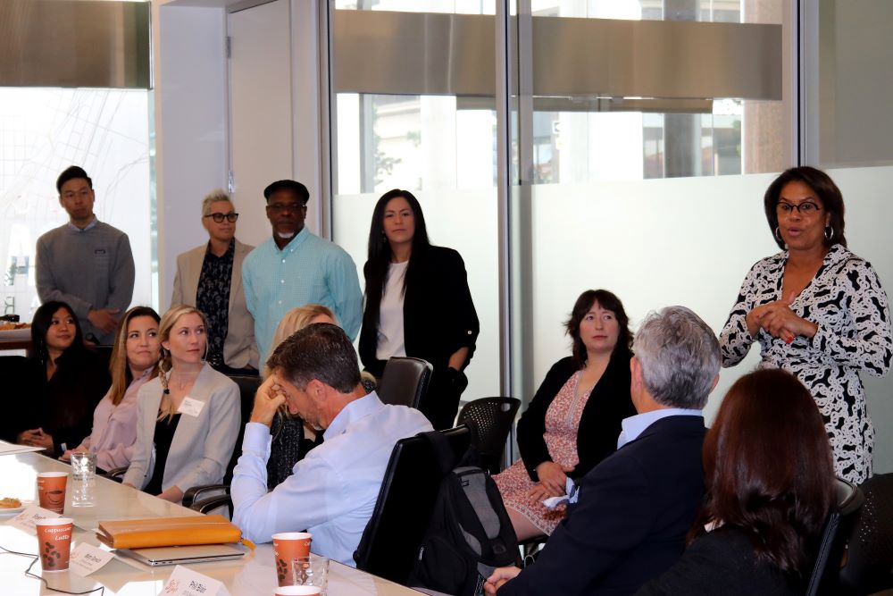 Photo of Julie Coker speaking at San Diego Tourism Authority Board Meeting.