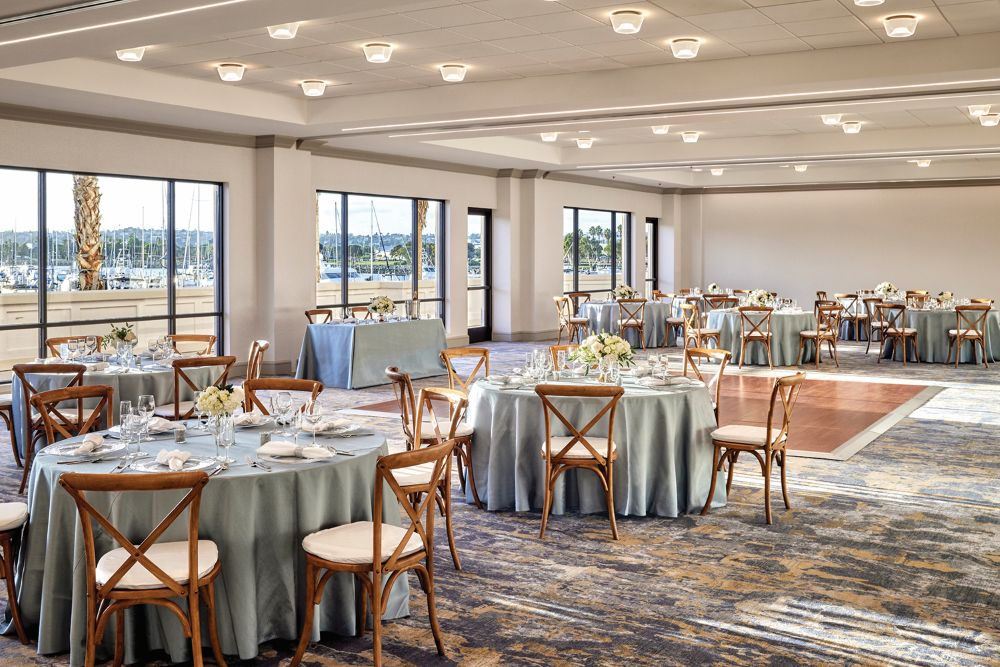 Sheraton San Diego Resort banquet room with round tables and chairs.
