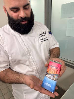 Photo of San Diego Convention Center Executive Chef Sufi Karaien with PCMA Chocolate Bar.