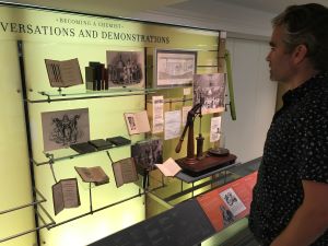 Photo of Science History Institute display with man looking at it.