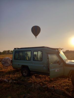 Shadows of Africa's Safari Car and Hot-Air Balloon