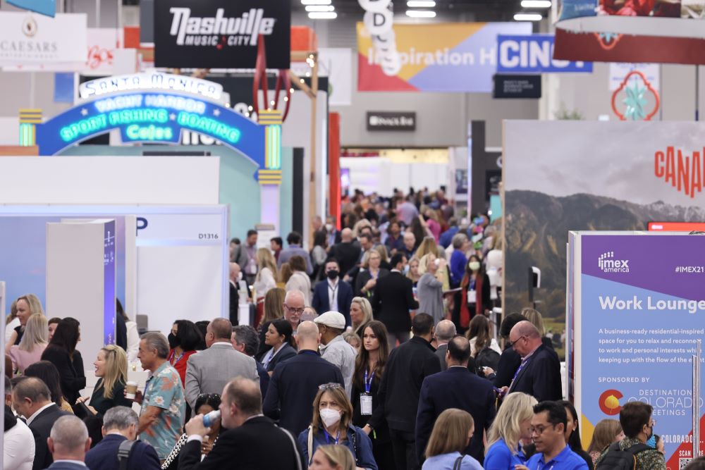 Photo of IMEX America exhibit show floor crowded with attendees.