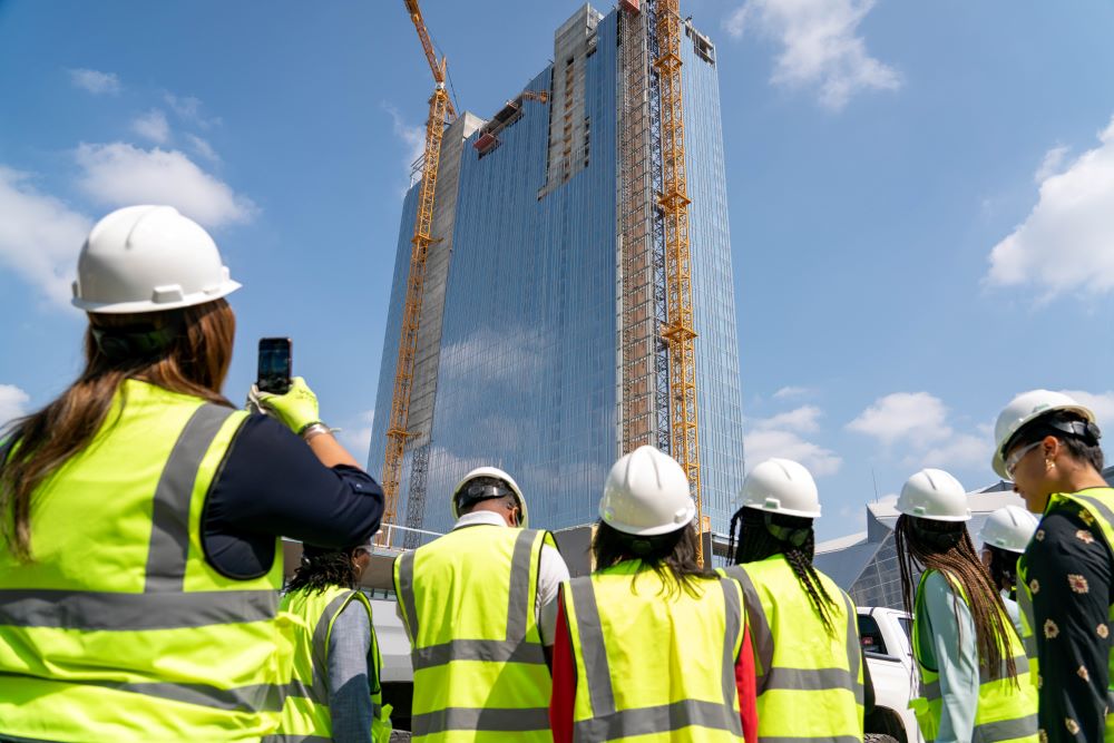 Atlanta's Signia by Hilton under construction, with people in hard hats looking on.